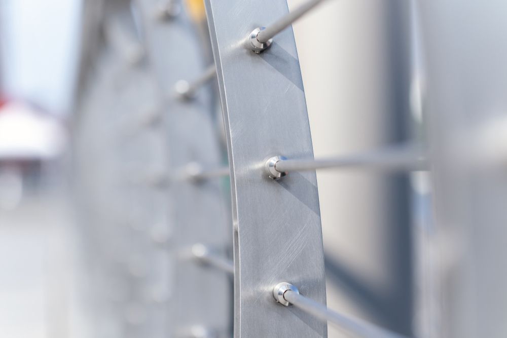 A Close up Of a Stainless Steel Railing with Screws on It — FBM Fabrication In Dapto, NSW