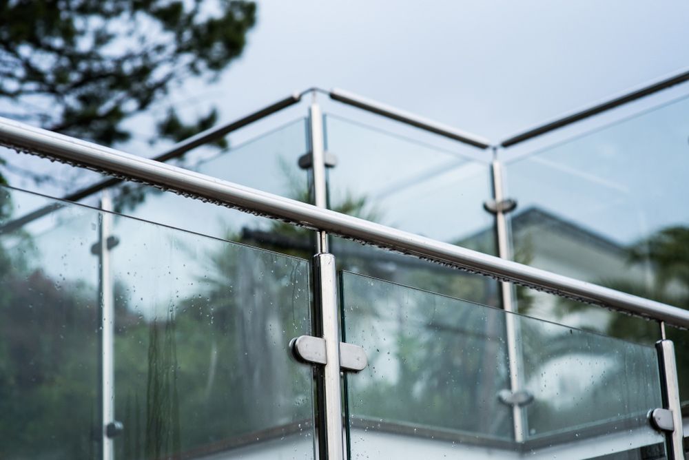A Close up Of a Glass Railing on A Balcony — FBM Fabrication In Dapto, NSW