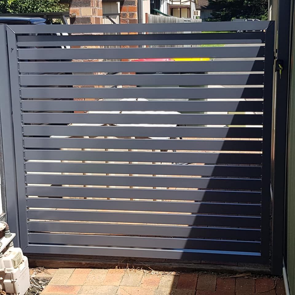 A Bunch of Metal Rolls Are Stacked on Top of Each Other in A Warehouse — FBM Fabrication In Dapto, NSW