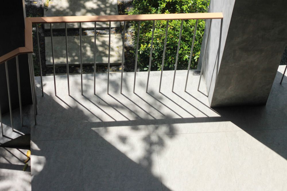 A Staircase with A Railing and A Shadow of A Tree on The Floor — FBM Fabrication In Dapto, NSW