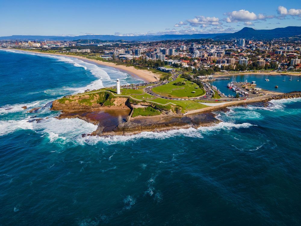 An Aerial View of A Lighthouse on A Small Island in The Middle of The Ocean — FBM Fabrication In Wollongong, NSW