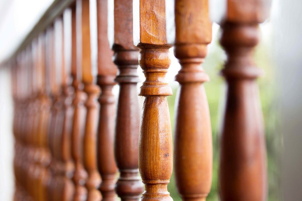 A Close up Of a Wooden Railing on A Balcony — FBM Fabrication In Dapto, NSW