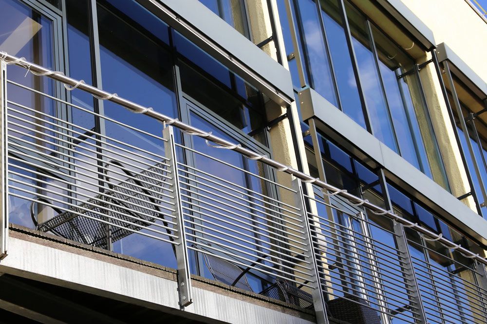 A Building with Lots of Windows and A Metal Railing — FBM Fabrication In Dapto, NSW