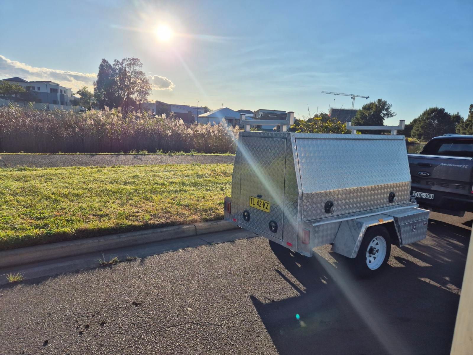 Silver Utility Trailer Parked on a Sunny Street — FBM Fabrication In Dapto, NSW