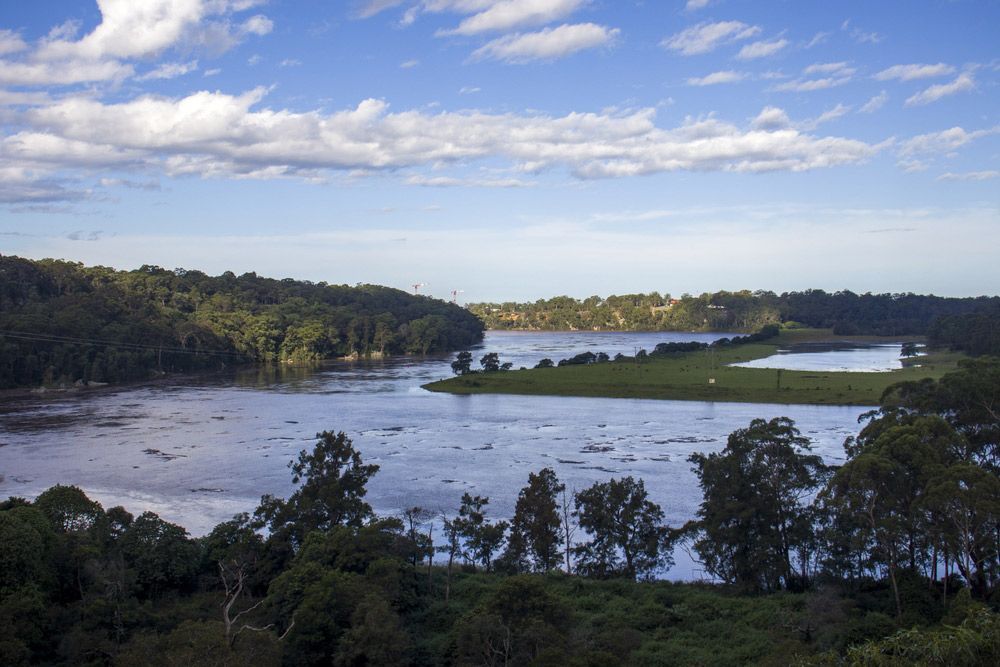 A Large Body of Water Surrounded by Trees on A Sunny Day — FBM Fabrication In Shellharbour, NSW