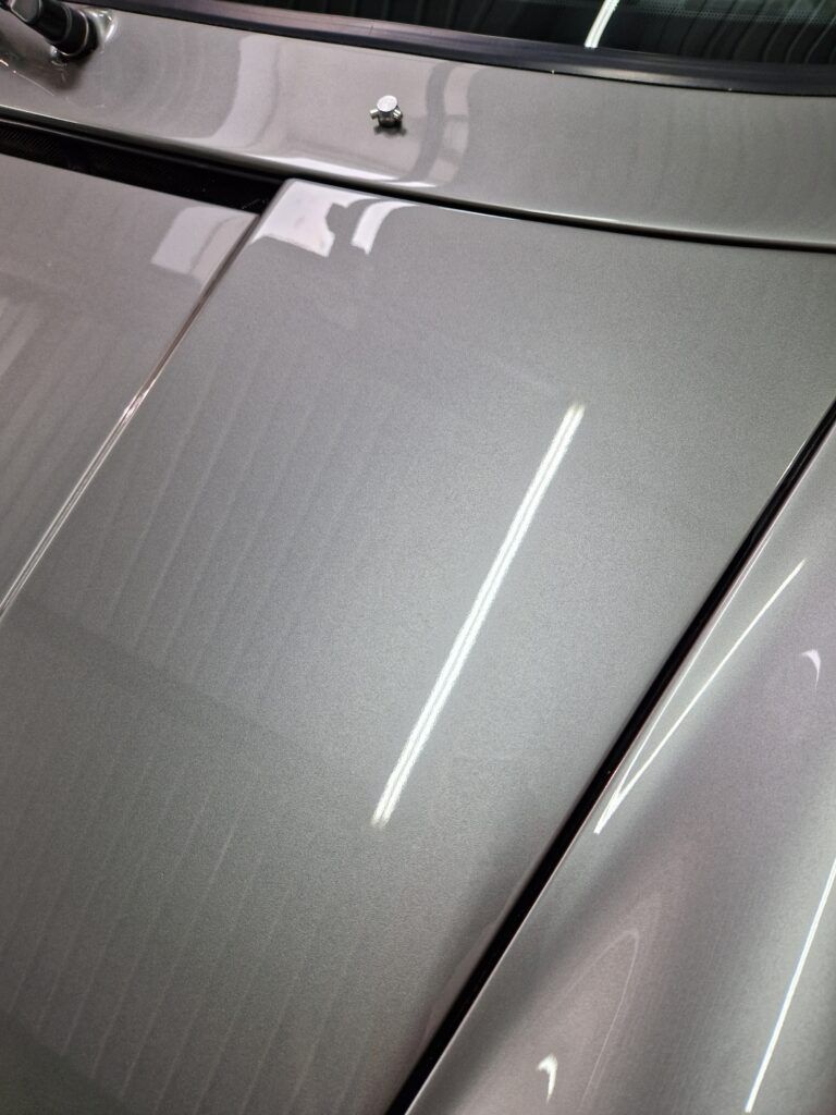 A close up of the hood of a car