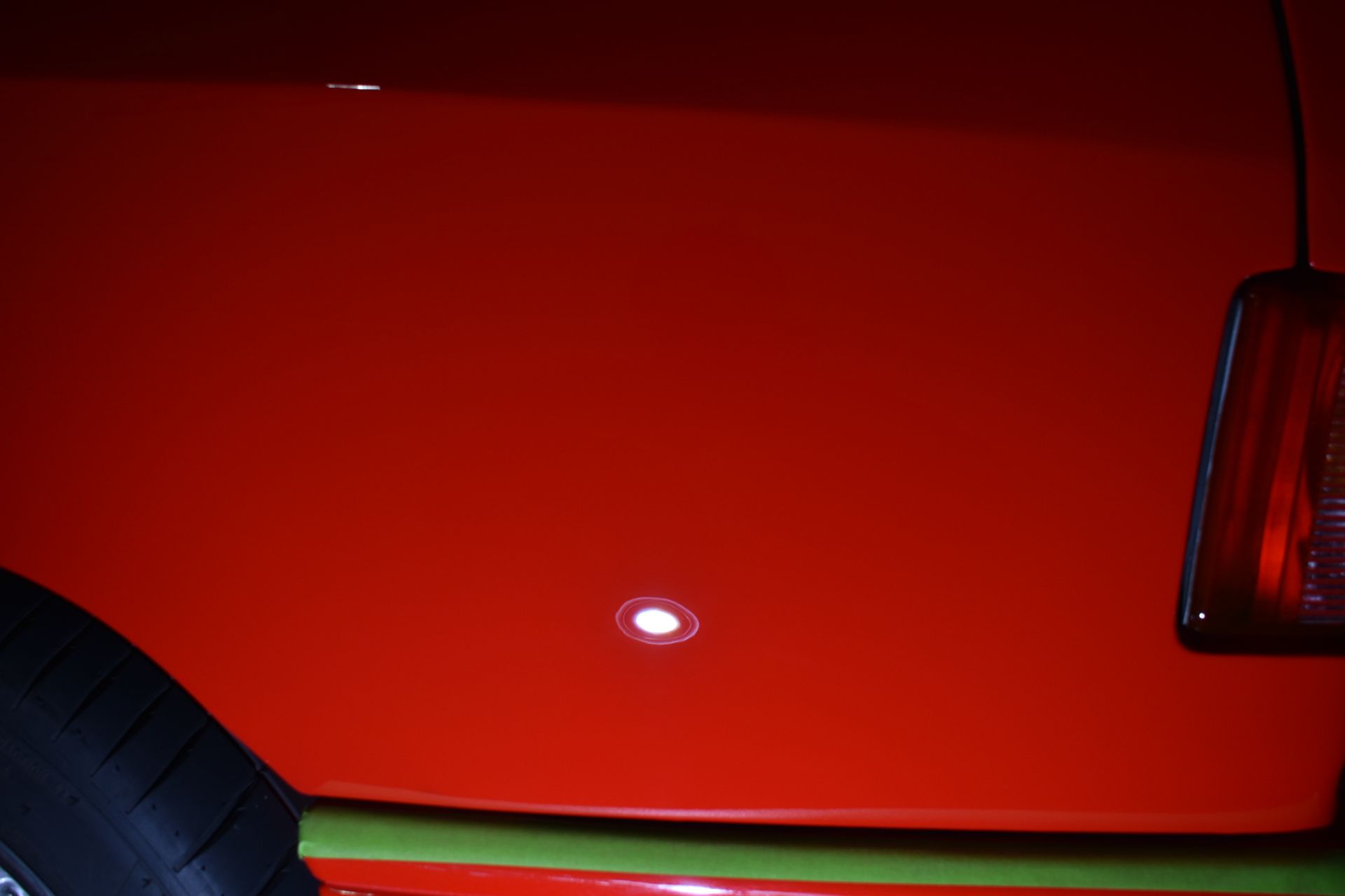 A close up of the back of a red car