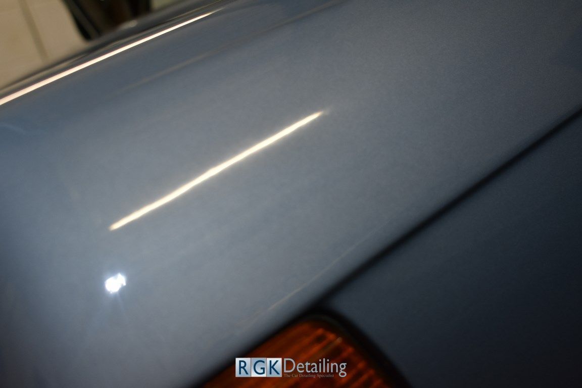 A close up of a car with rgk detailing written on it
