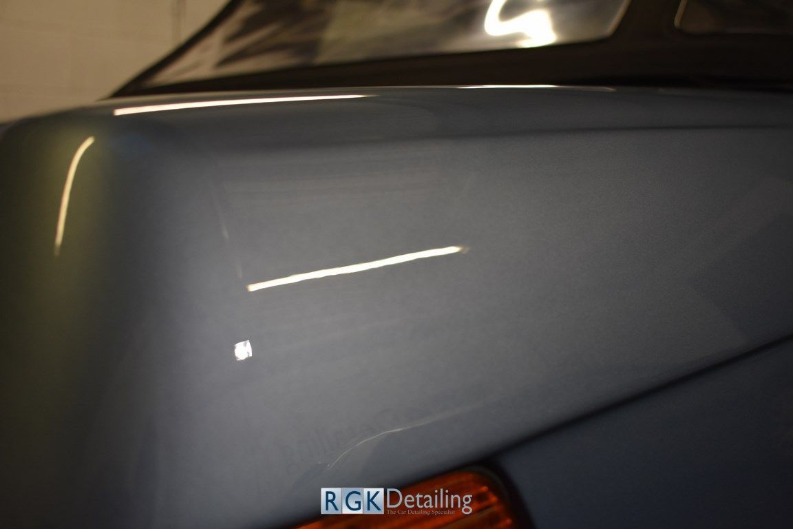A close up of a car with the words rgk detailing on it
