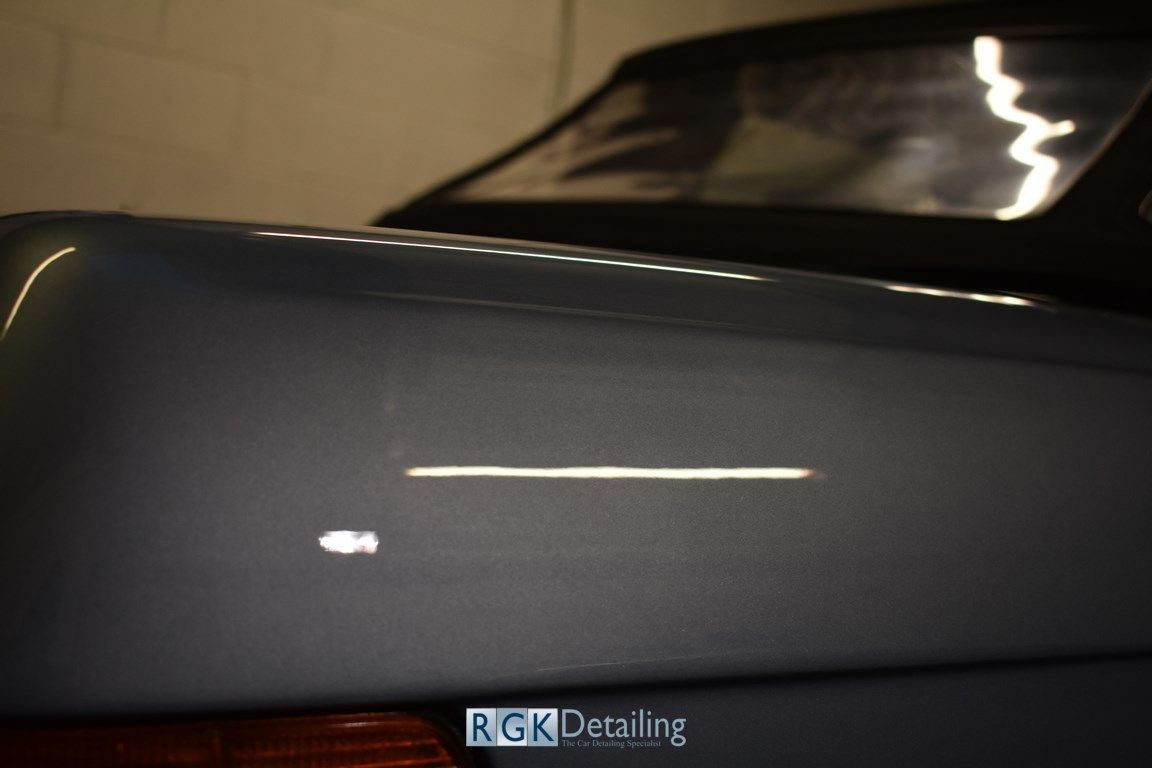 A close up of a car with rgk detailing written on it