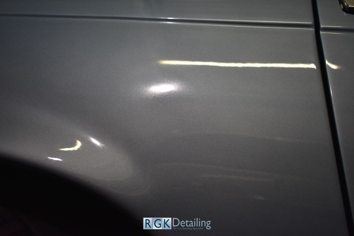 A close up of the side of a car with the words rgk detailing on it