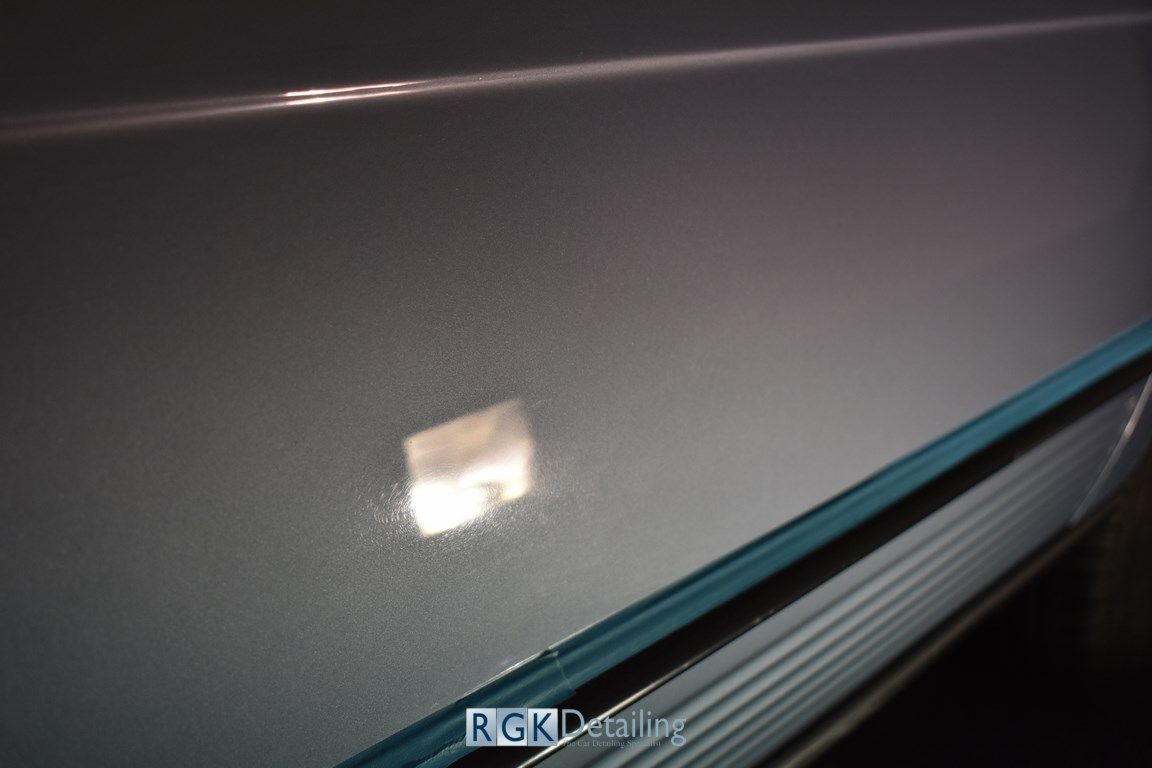 A close up of a gray surface with rgk detailing written on it