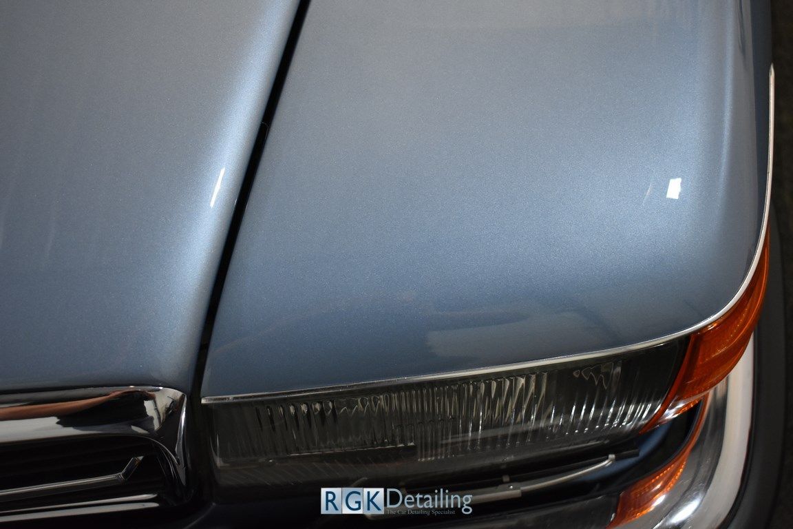A close up of a car hood with rgk detailing written on it