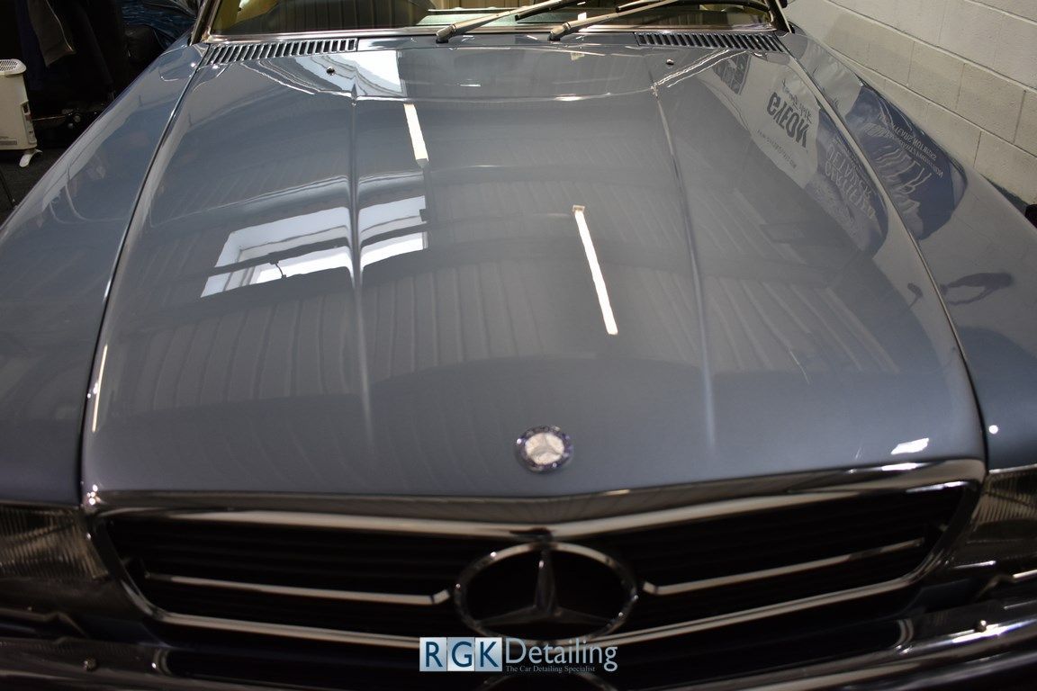 A close up of the hood of a mercedes benz car