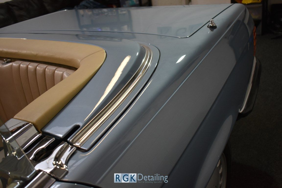 A close up of a car with the words rgk detailing on the bottom