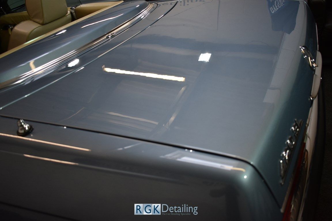 A close up of the trunk of a car with the words rgk decaling on the bottom