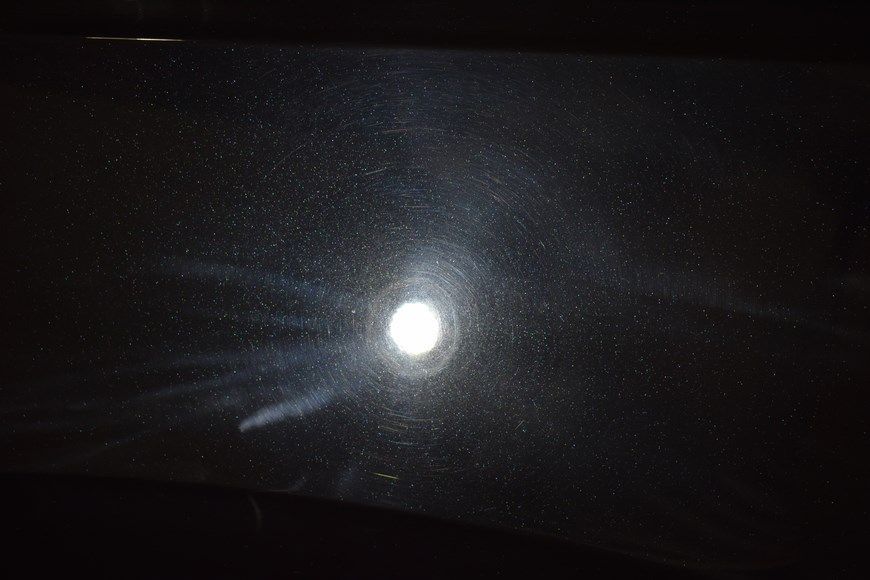 A close up of a full moon in the night sky.