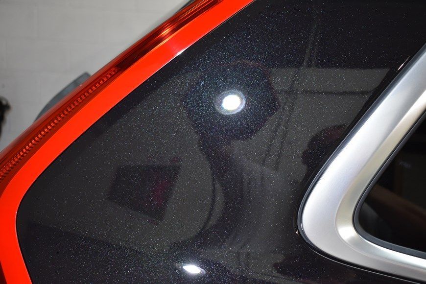 A black car with a red stripe on the side