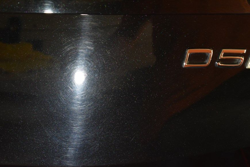 A close up of a black car with the letters d51 on it
