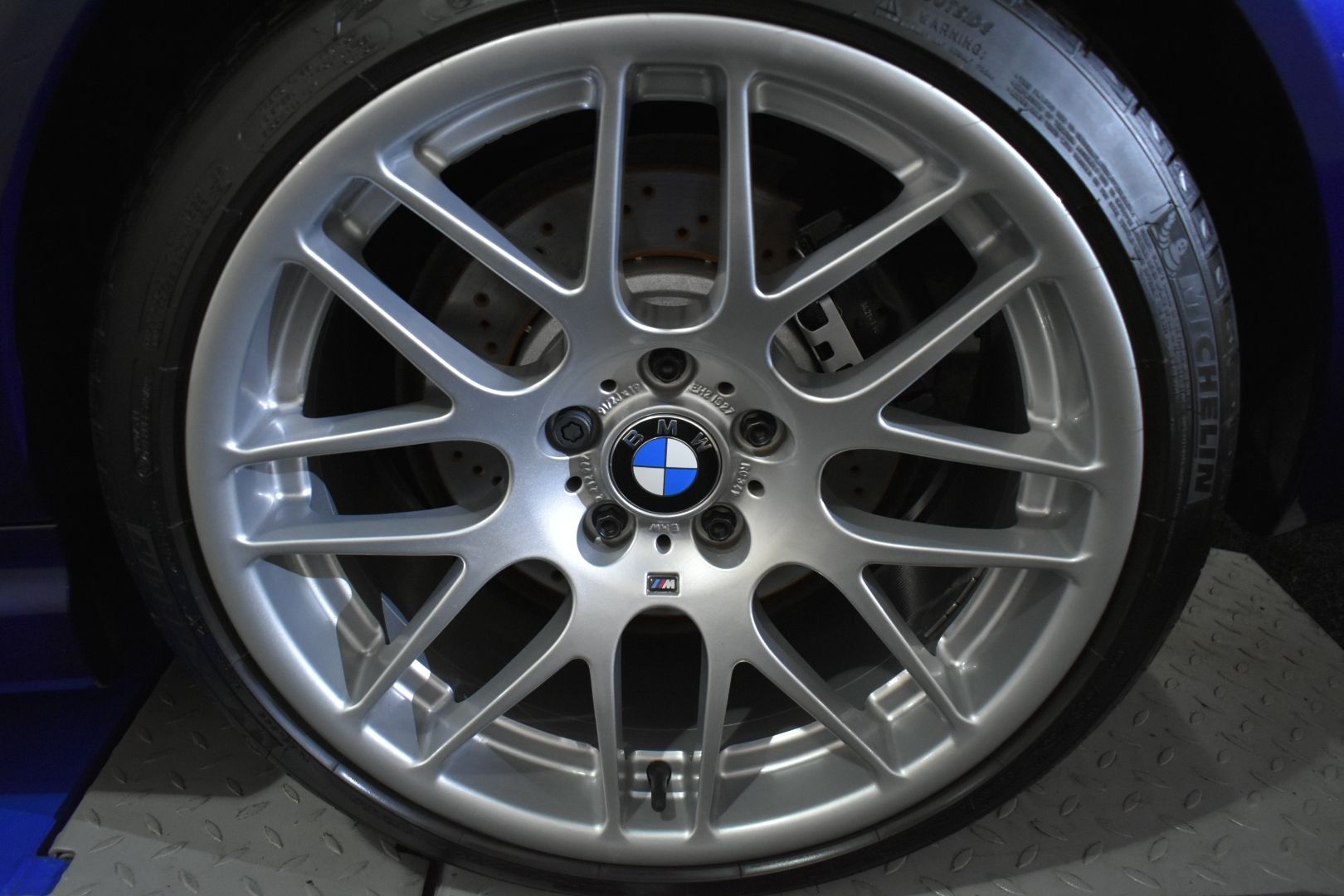 A close up of a bmw wheel and tire