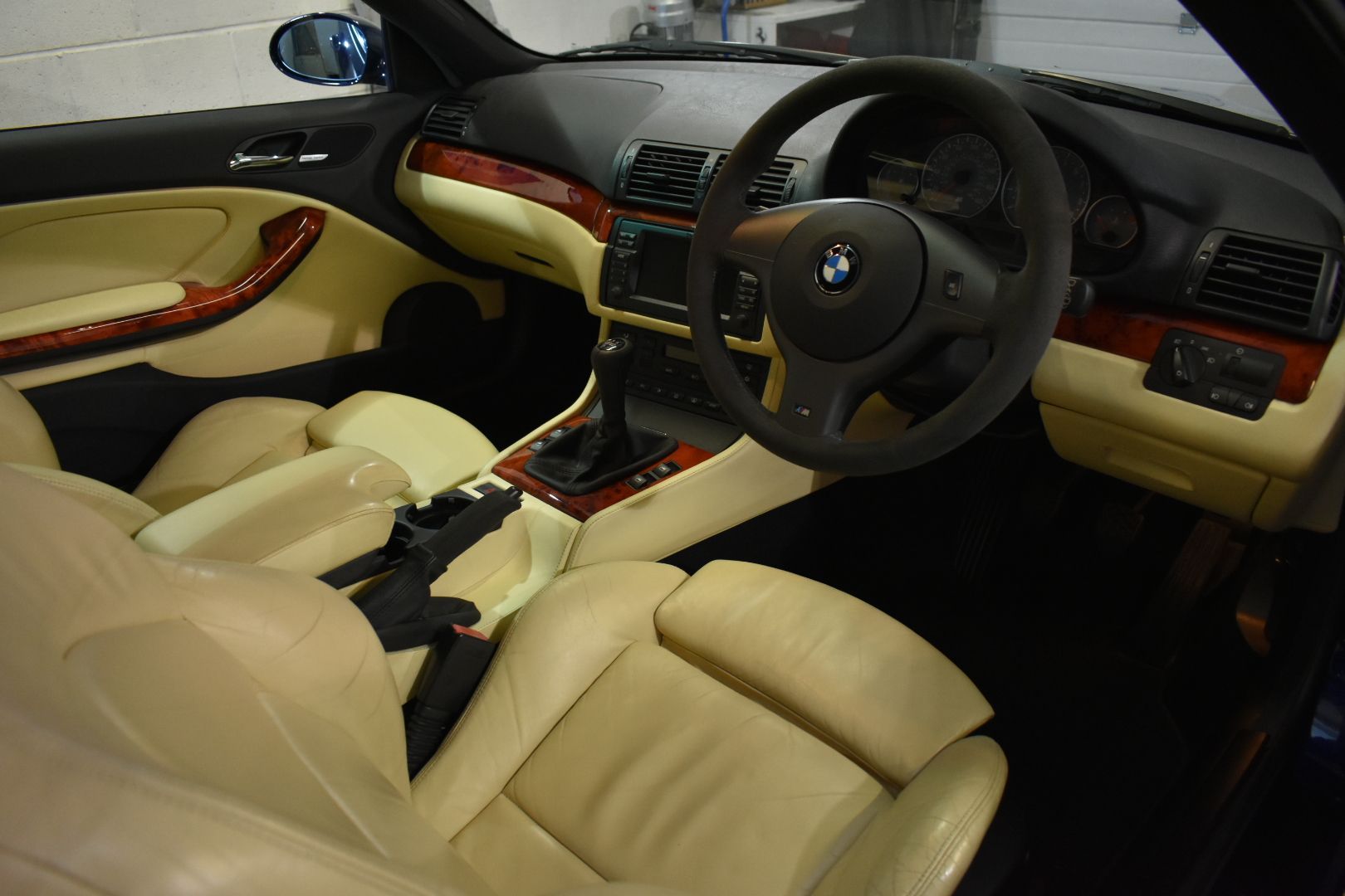 The interior of a bmw with tan leather seats
