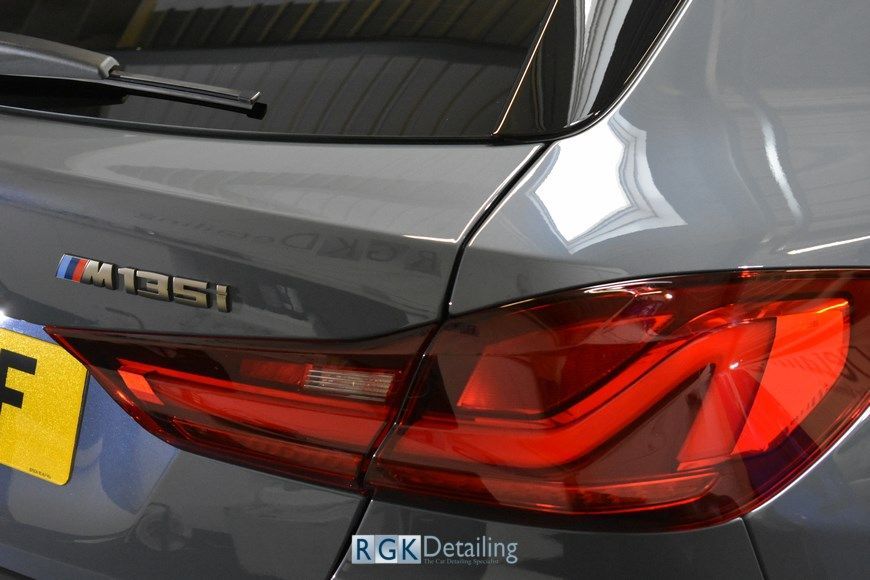A close up of the back of a car with a license plate that says f