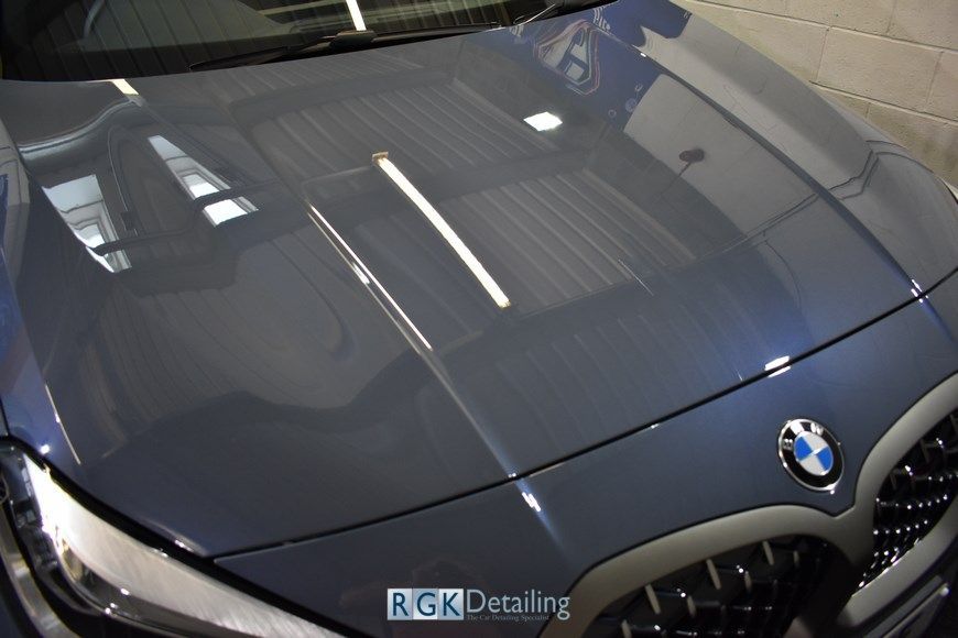 A close up of the hood of a bmw car