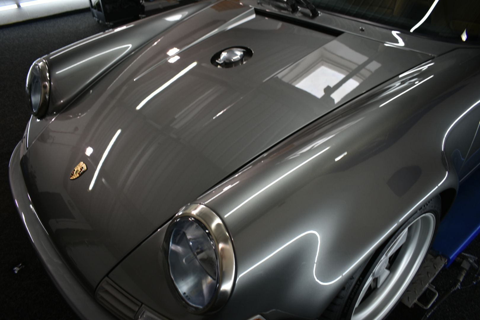 A close up of the hood of a porsche