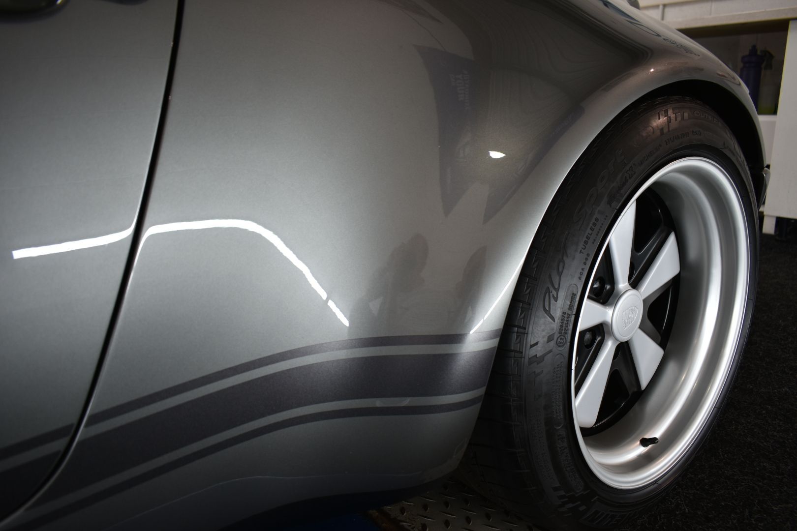 A close up of a car wheel with a tire on it