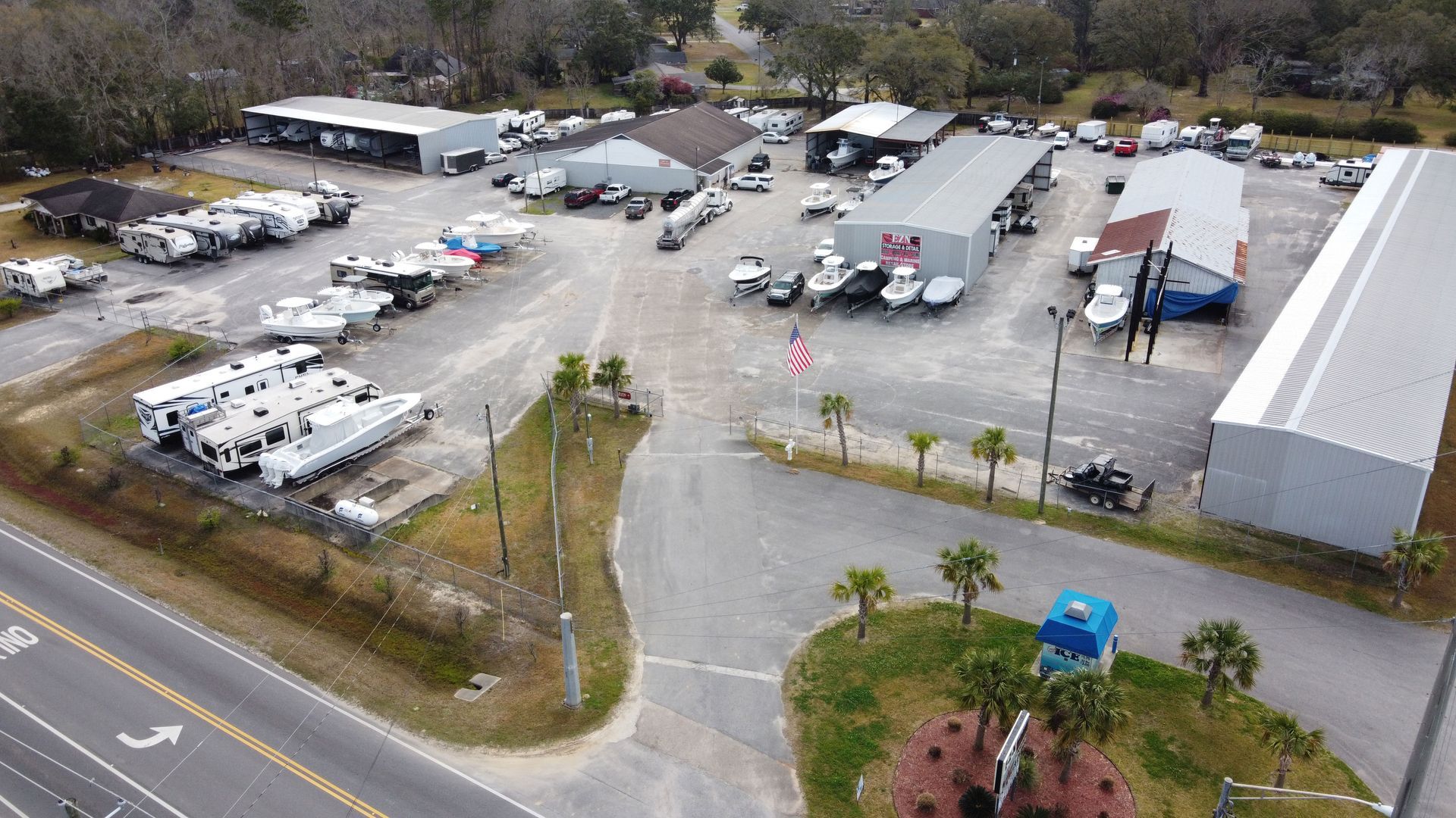 An aerial view of a large parking lot filled with lots of vehicles.