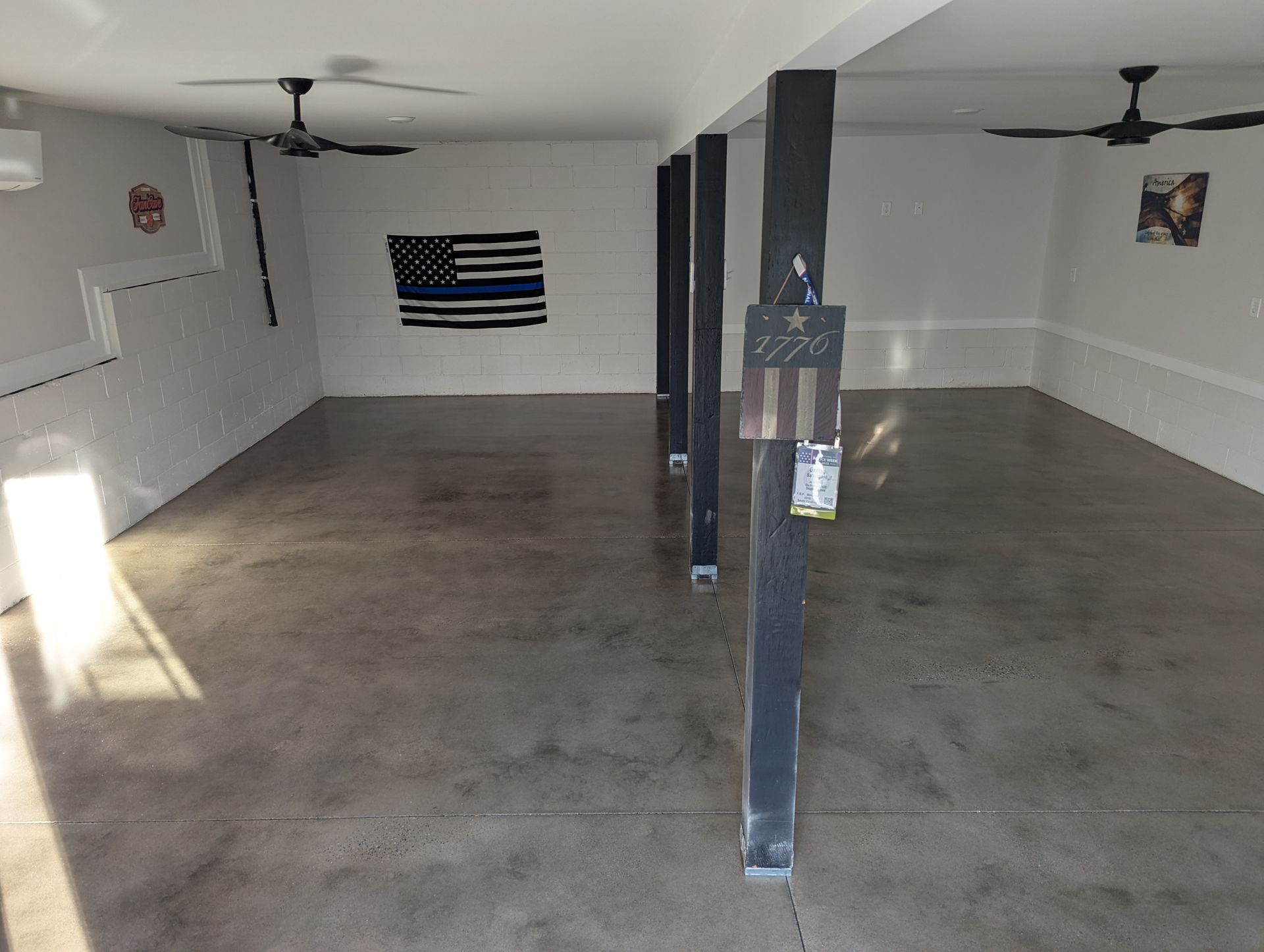 Polished concrete floor in a Spartanburg basement with a smooth, even finish.
