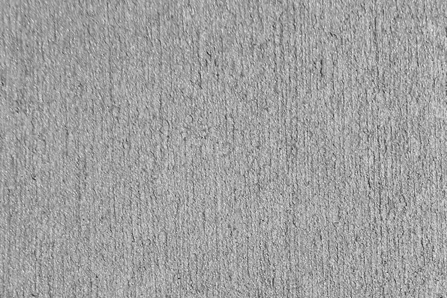 A close up of a gray carpet texture.