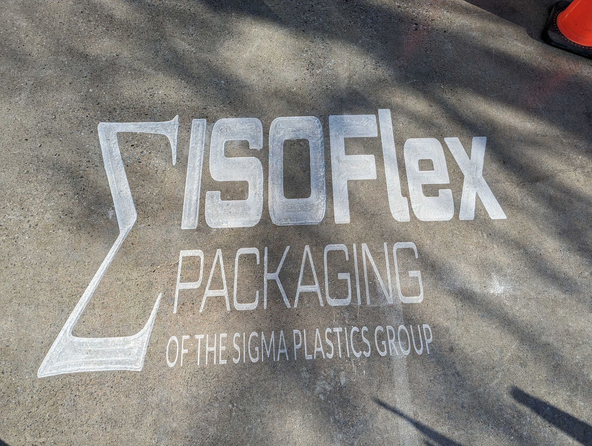 Isoflex packaging of the sigma plastics group is engraved on the concrete