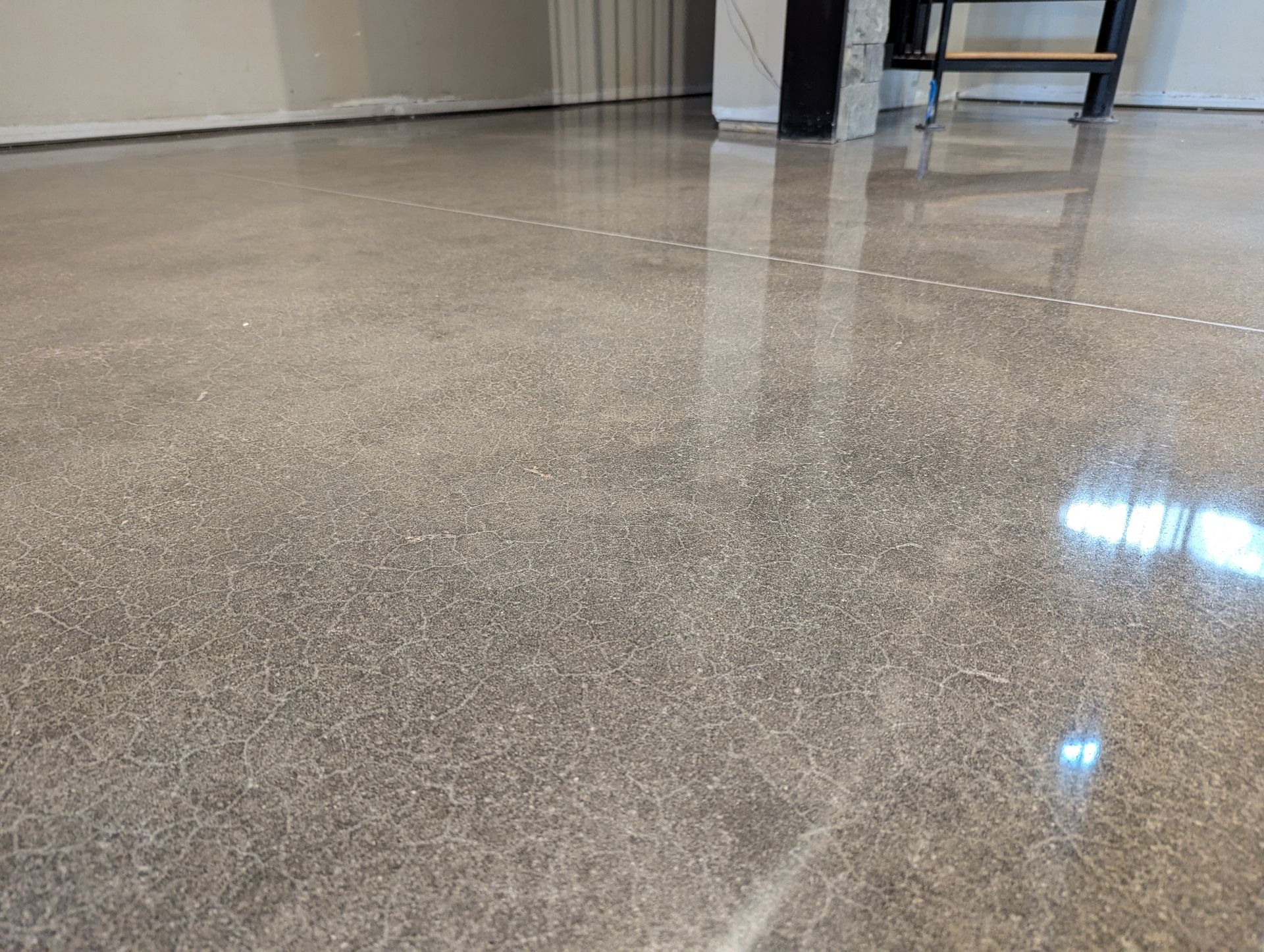 A large room with a white floor and a lot of windows