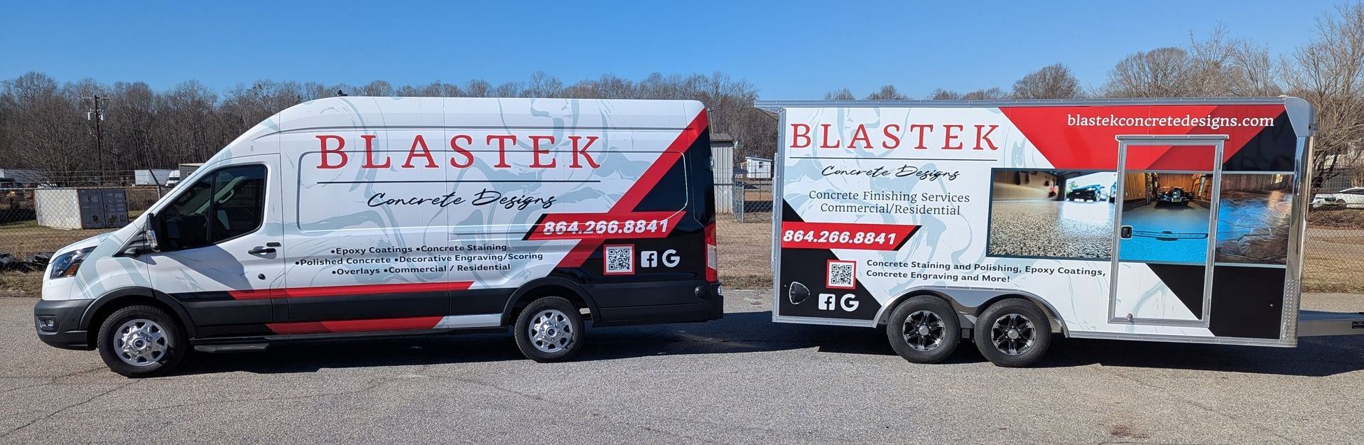 Two vans are parked next to each other in a gravel lot.