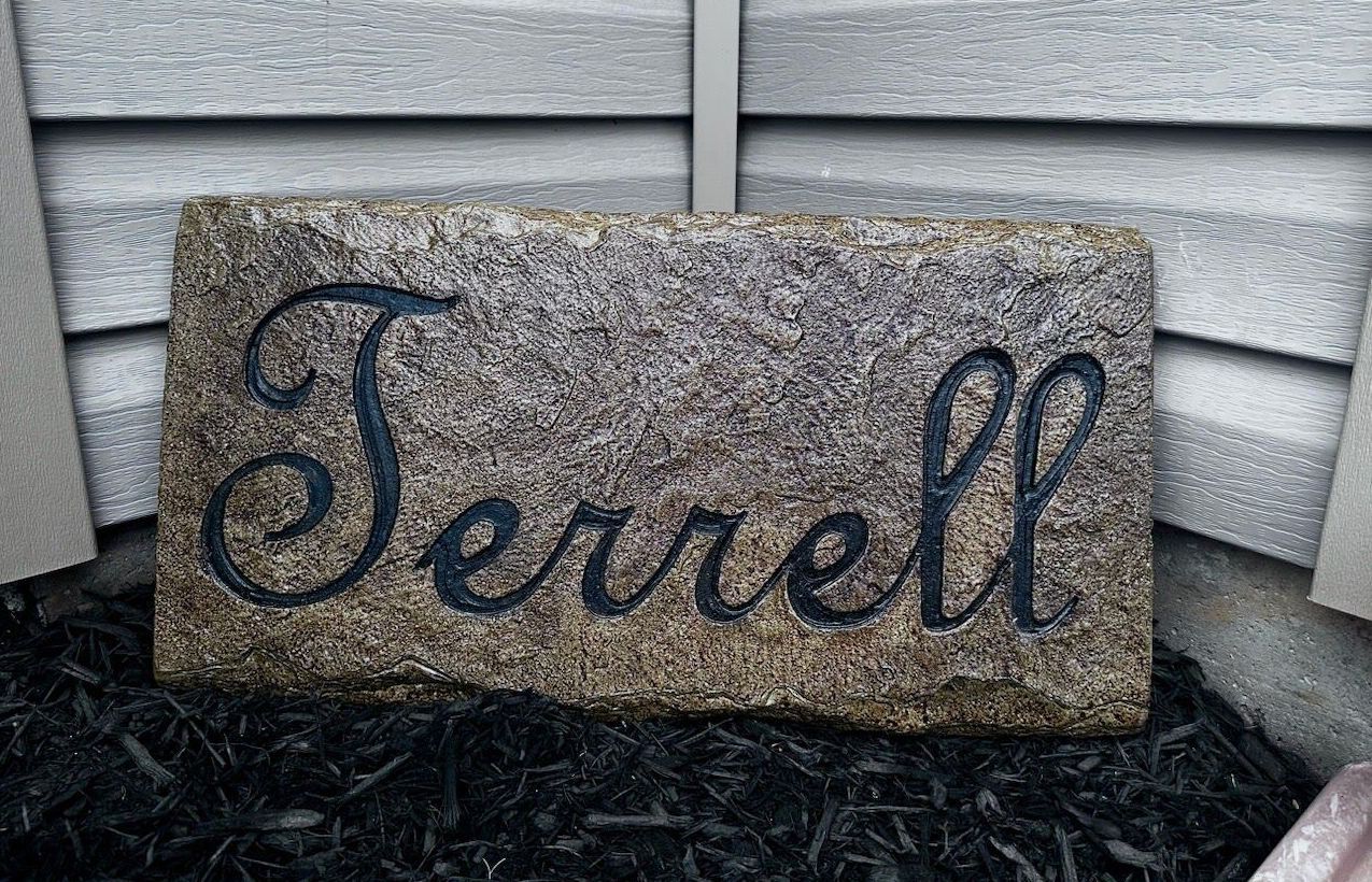 A stone with the name ferrell engraved on it