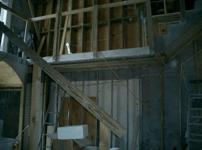 A staircase is being built in a building under construction.