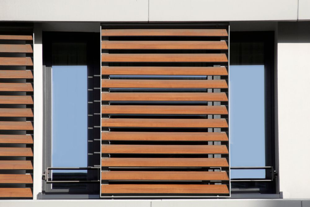 Wooden Blinds Partially Open — Huntlee Blinds and Shutters in Badagarang, NSW