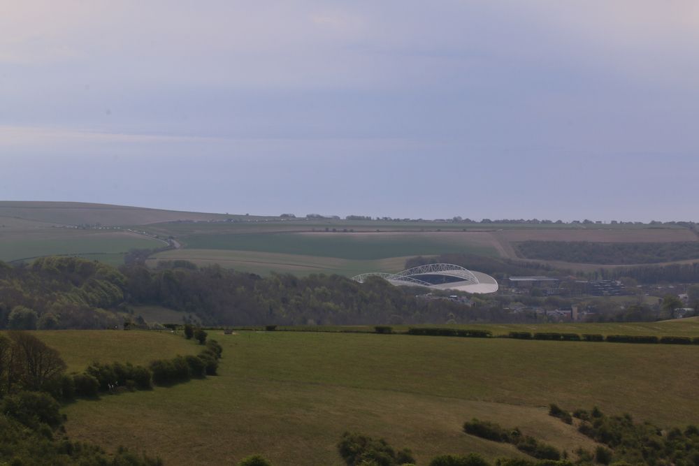 A Large Building Is Sitting On Top Of A Hill In The Middle — Huntlee Blinds and Shutters in Albion Park, NSW