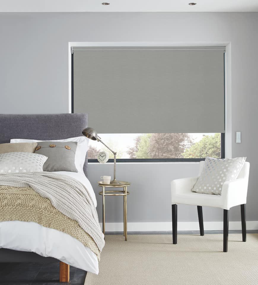 A Bedroom With A Bed , Chair — Huntlee Blinds and Shutters in Albion Park, NSW