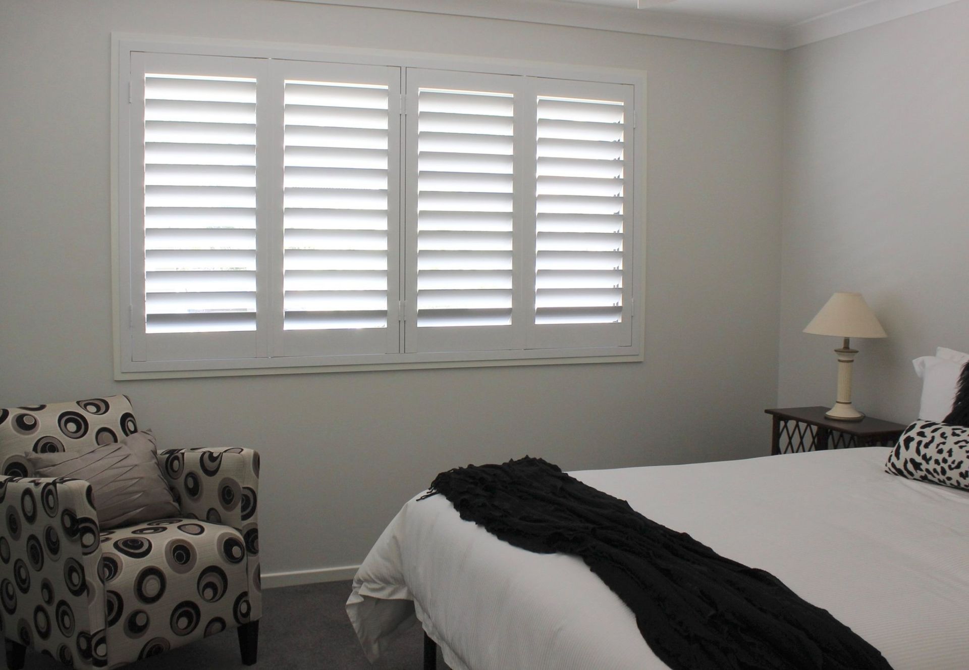 Bedroom with White Shutters