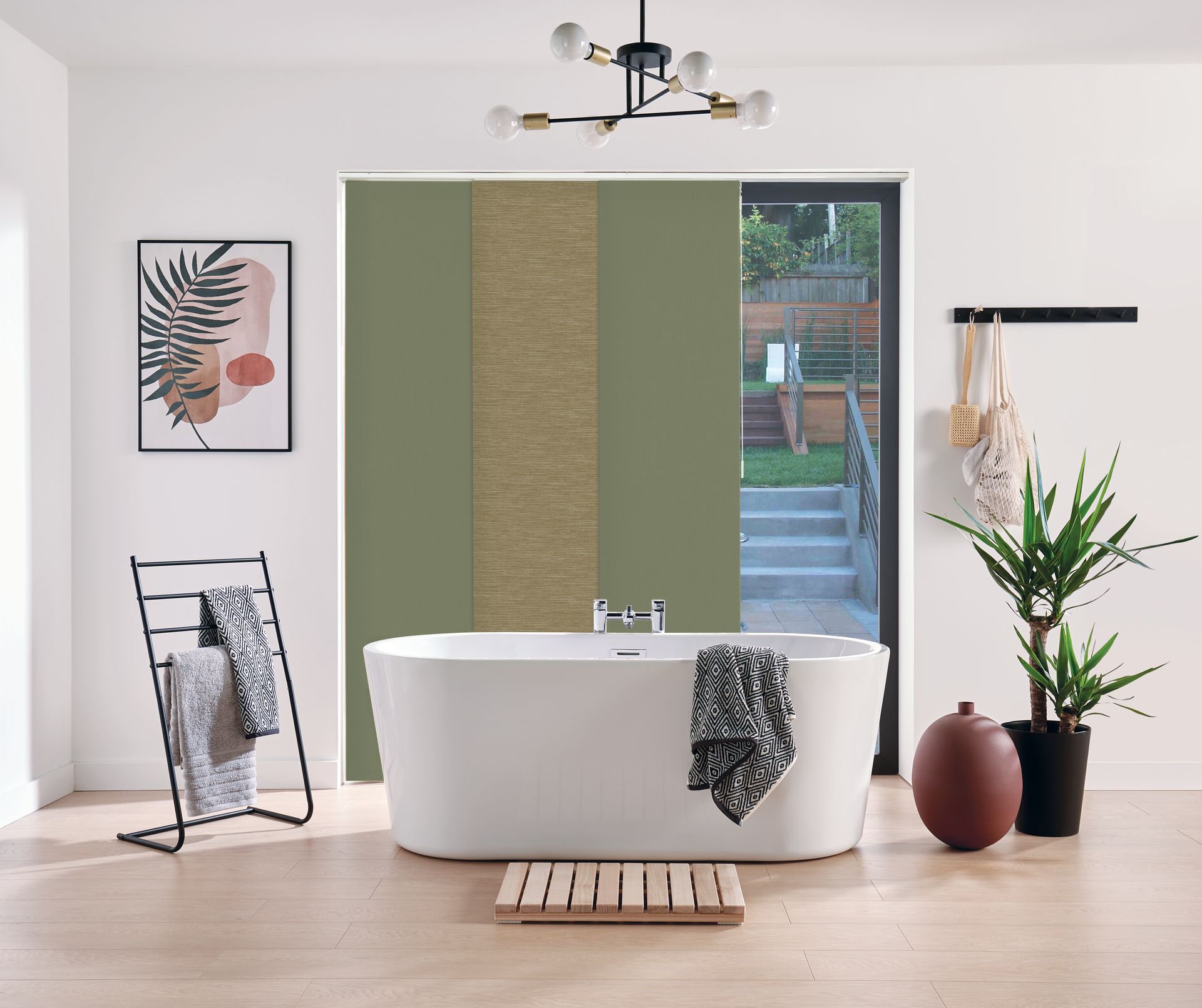 A bathroom with a bathtub , towel rack , and plant — Huntlee Blinds and Shutters in Badagarang, NSW