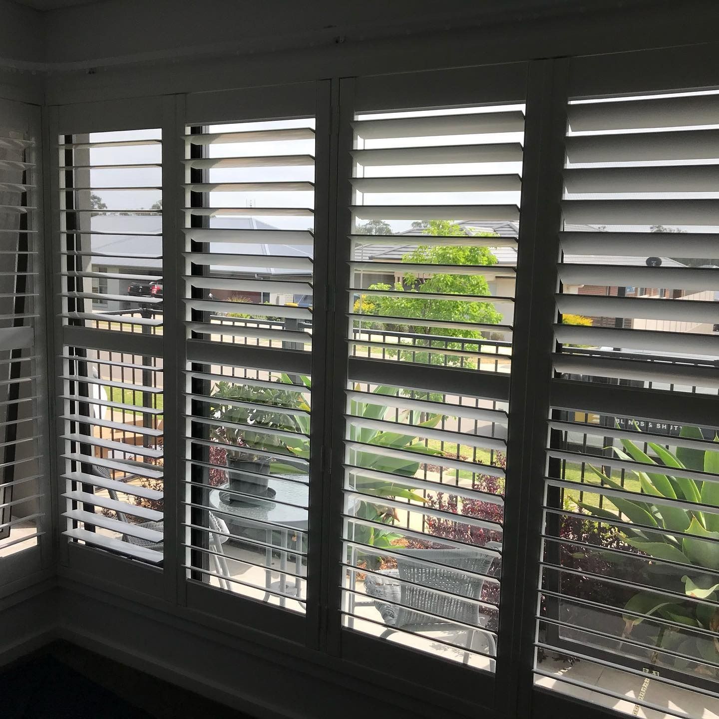 White Shutters Partially Open