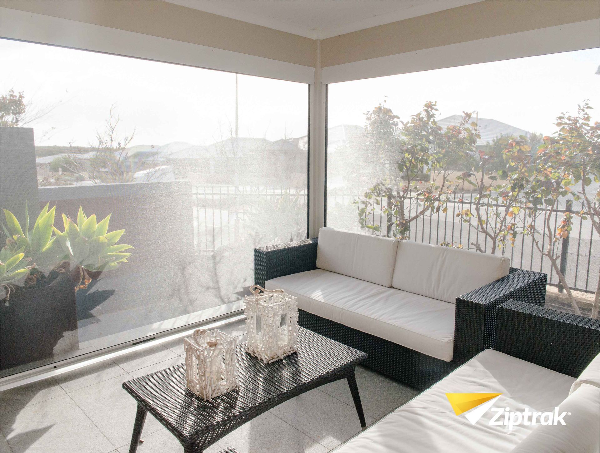 A living room with a couch and a coffee table — Huntlee Blinds and Shutters in Badagarang, NSW