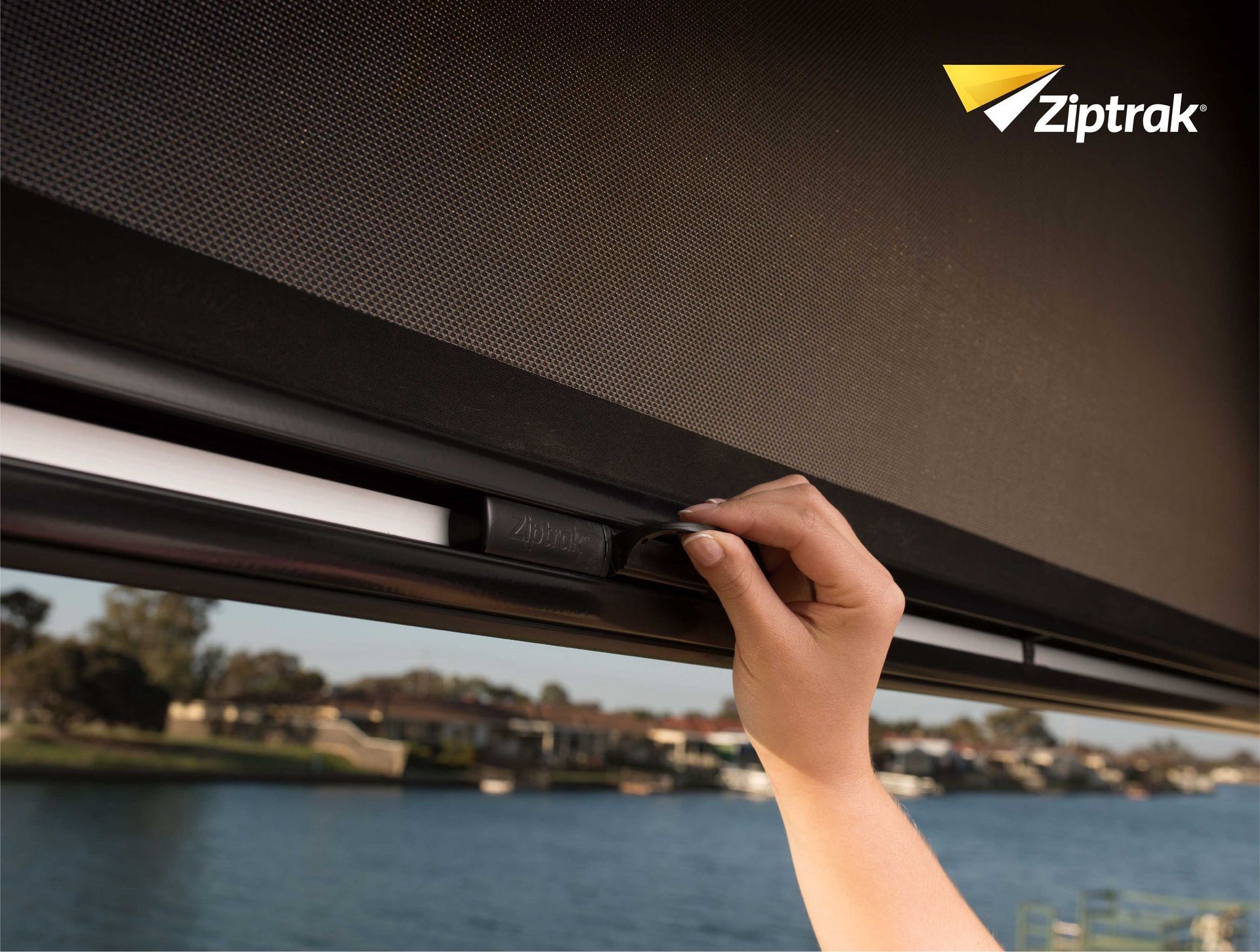 A Bedroom With A Bed And A Window With Blue Blinds — Huntlee Blinds and Shutters in Badagarang, NSW