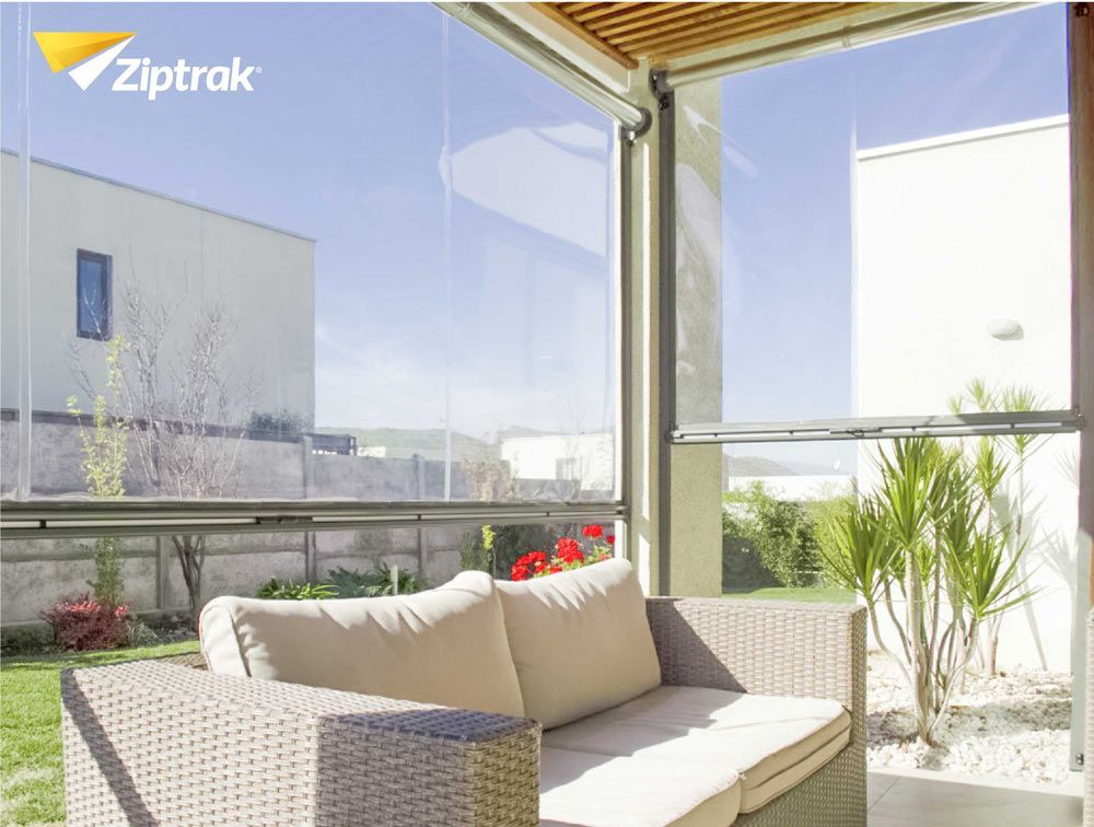 A Patio With A Couch And Chairs And A Sign That Says Ziptrak — Huntlee Blinds and Shutters in Nowra, NSW
