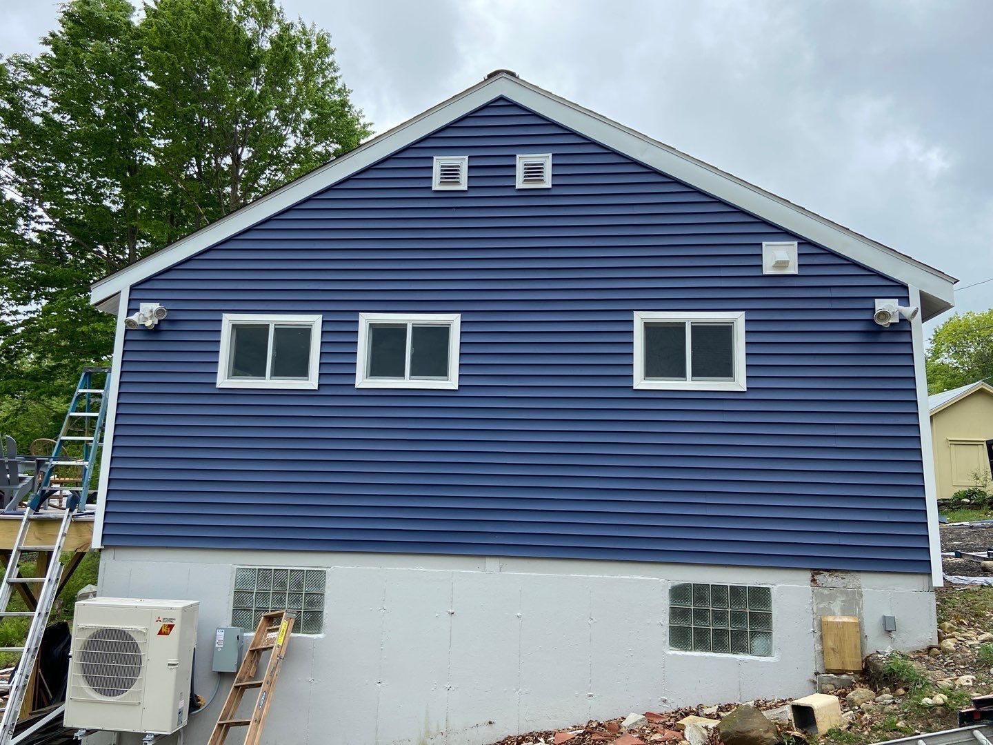 new blue siding with white trim