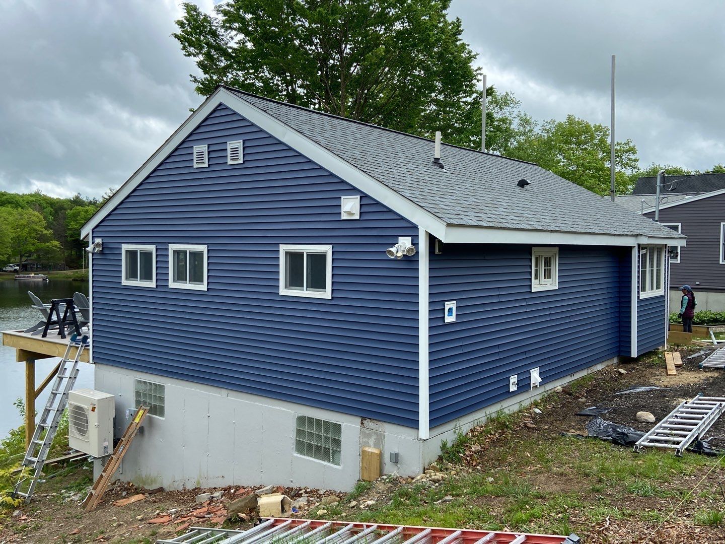 new blue monogram siding installed on ranch home