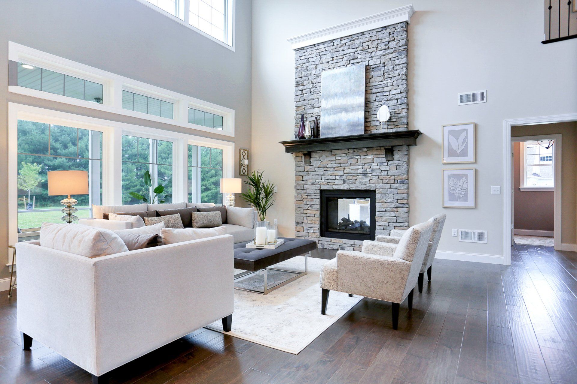 Multi view gas fireplace with stone and accent detail features in our Silverbrooke floor plan at Willow Creek Farms
