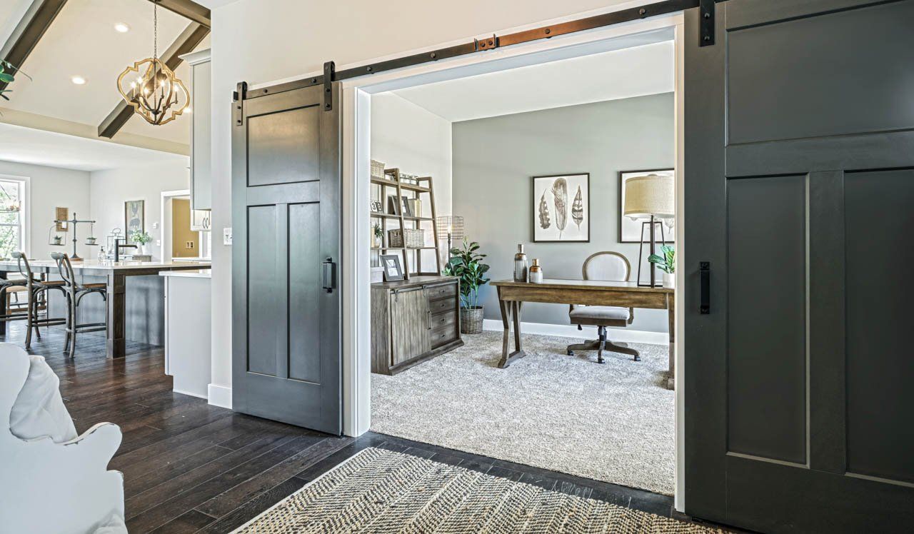 Double Sliding Barn Door Entry to Home Office in New Home by Landmark Homes in PA